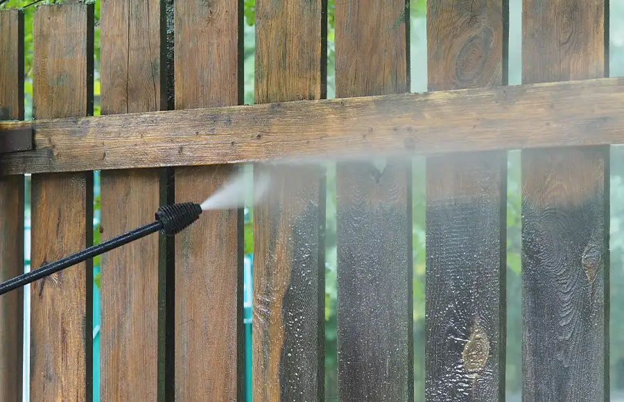 close up view of pressure washing a wooden fence - Fairview Heights, IL