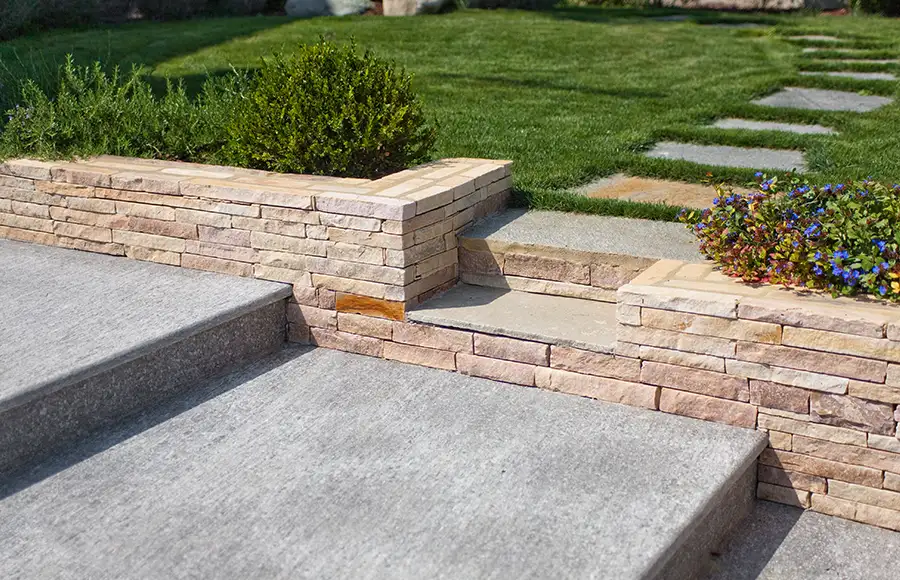 pressure/power washed stone, different types: stone dividing wall, walkway, steps - Fairview Heights, IL