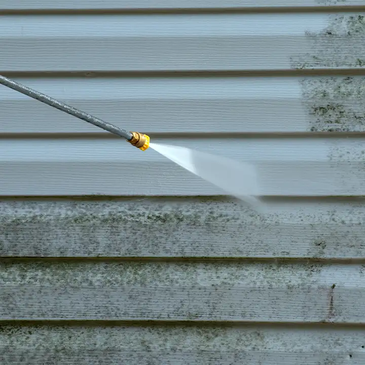 Power or Pressure Washing in progress, washing the vinyl siding of a house - Fairview, Heights, IL