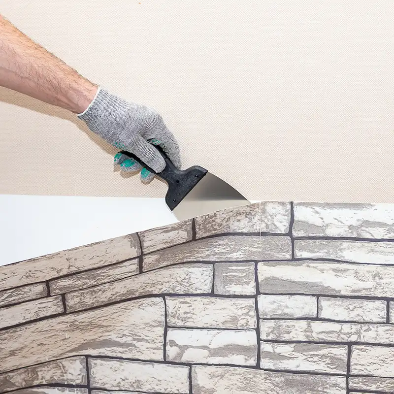 professional removing old wallpaper from the wall (brick facade - Fairview, Heights, IL