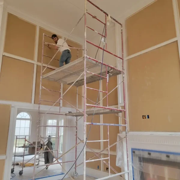 Tyler Painting and Drywall Co. - professional on scaffolding completing project - Fairview Heights, IL